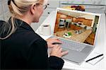 Woman In Kitchen Using Laptop to Research Home Improvement Ideas. Screen can be easily used for your own message or picture. Picture on screen is my copyright as well.