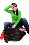 woman packs her clother. over white background