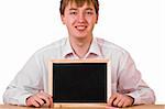 Young Man with blank blackboard sitting on white background