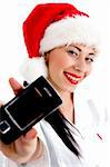 woman wearing christmas hat and showing mobile against white background