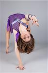 modern style dancer posing. Isolated over gray background.