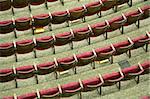 purple empty cinema seats with white numbers, photo taken from roof