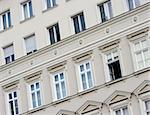 Front of a block of flats with many windows