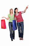 two attractive women with shopping bags. over white background