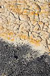 Fragment of  orange clay and salt mineral deposits in geological formations in Ubehebe Volcano, Death Valley National Park