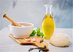 dough, mortar and pestle, olive oil, bazil and garlic