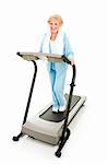 Beautiful senior woman stays fit by exercising on a treadmill.  Isolated on white.