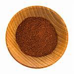 Closeup of Chili Powder in Wooden Bowl on White