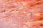 Wall pattern of Coloured Canyon formed by natural elements over centuries cascade with colours as a result of ferrous oxide and manganese