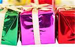 Colorful Christmas gift boxes on white background. Shallow depth of field