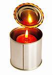 red candle on a tin can ovr white background