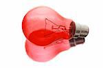 Red Light Bulb with Reflection on White Background