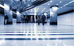 Subway station with train in motion. Motion blur. Blue tint