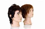 Modeling heads for hairdressers and makeup artist on white background, reflective surface, studio shot,