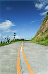 rural road climbs through the mountains in southern luzon in the philippines,