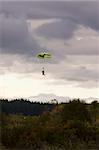 Tandem Paragliders Decending onto Ground