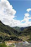 clouds towering in blue sky reflected in the ancient rice terraces of batad, in northern luzon, the philippines