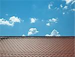 A photography of a roof and a blue sky