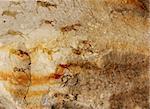 Wall cave with drawings of the primitive person - collage