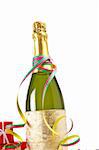 Champagne bottle with gifts, ribbons and confetti for celebrations