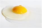 Broken egg isolated from white