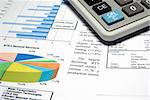 Calculator and finance diagrams.