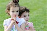 An outdoor portrait of two 4 year old girls