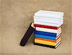 Multicolor books on the canvas background