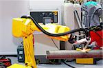 Yellow robotic arm for automatic welding pipes