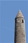 a round tower near ballyduff county kerry ireland with blue sky background