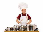Cooking has a fun beat - ecstatic boy chef banging the cooking pots with wooden spoons, isolated