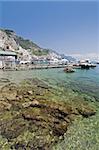 Amalfi Coast, transparent water in the harbor with boat. Naples - Best of Italy