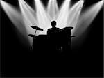 Black silhouette of the musician which plays on a scene