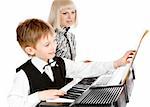 Mother and her preschool son playing electric piano