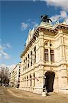 Statue of a man on top of horse on a roof of building in Vienna, Austria