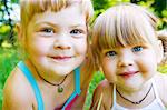 Portrait of two cute smiling sisters or friends