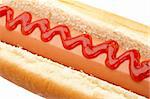 A hot dog with ketchup isolated on white background. Shallow depth of field