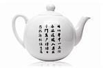 Teapot in asian style with hieroglyphics. Isolated on white.