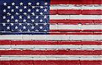 Flag of the United States of America painted onto a grunge brick wall