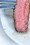 fresh juicy beef ribeye steak grilled sliced on a plate