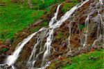 beautiful cascade in the morning light,  HDR. Long exposure time gives an "out of time" feeling.