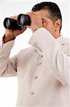 Businessman with binoculars looking to the future