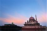 Putra Mosque is the principal mosque of Putrajaya, Malaysia. Building on the left is Perdana Putra which is Malaysian Prime Minister's office.