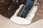 View of down Hoover Dam at hydroelectric powerplant and Colorado River.