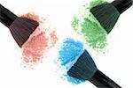 Three color powders set and black brush isolated