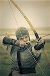 bows woman / medieval armor / historical story  / retro split toned