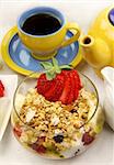 Healthy and hearty breakfast of muesli, strawberries and tea.