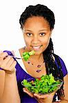 Isolated portrait of black teenage girl with salad bowl