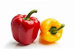 isolated red and yellow peppers on white background