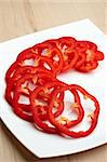 Sliced red pepper on white plate